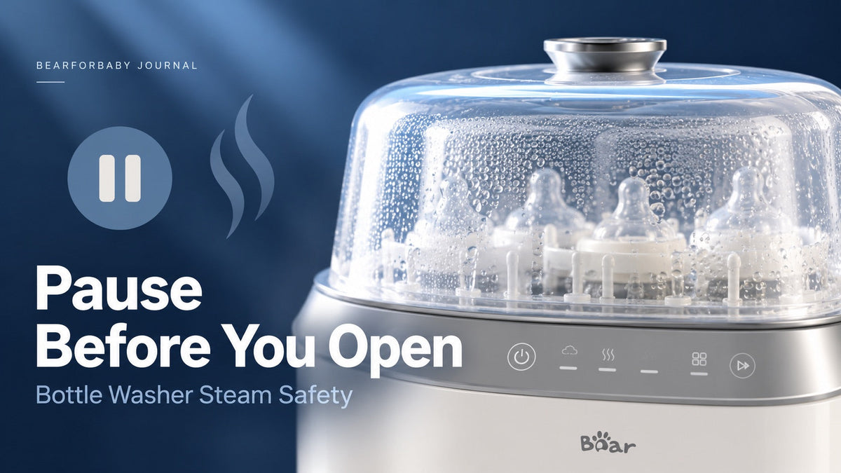 Close-up of the BEAR washer’s closed clear lid with a pause symbol, introducing careful handling after steam cycles.
