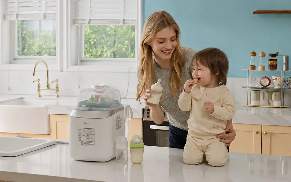 Bearforbaby Bottle Washer Pro with baby bottles as a mother and toddler enjoy time in the kitchen.