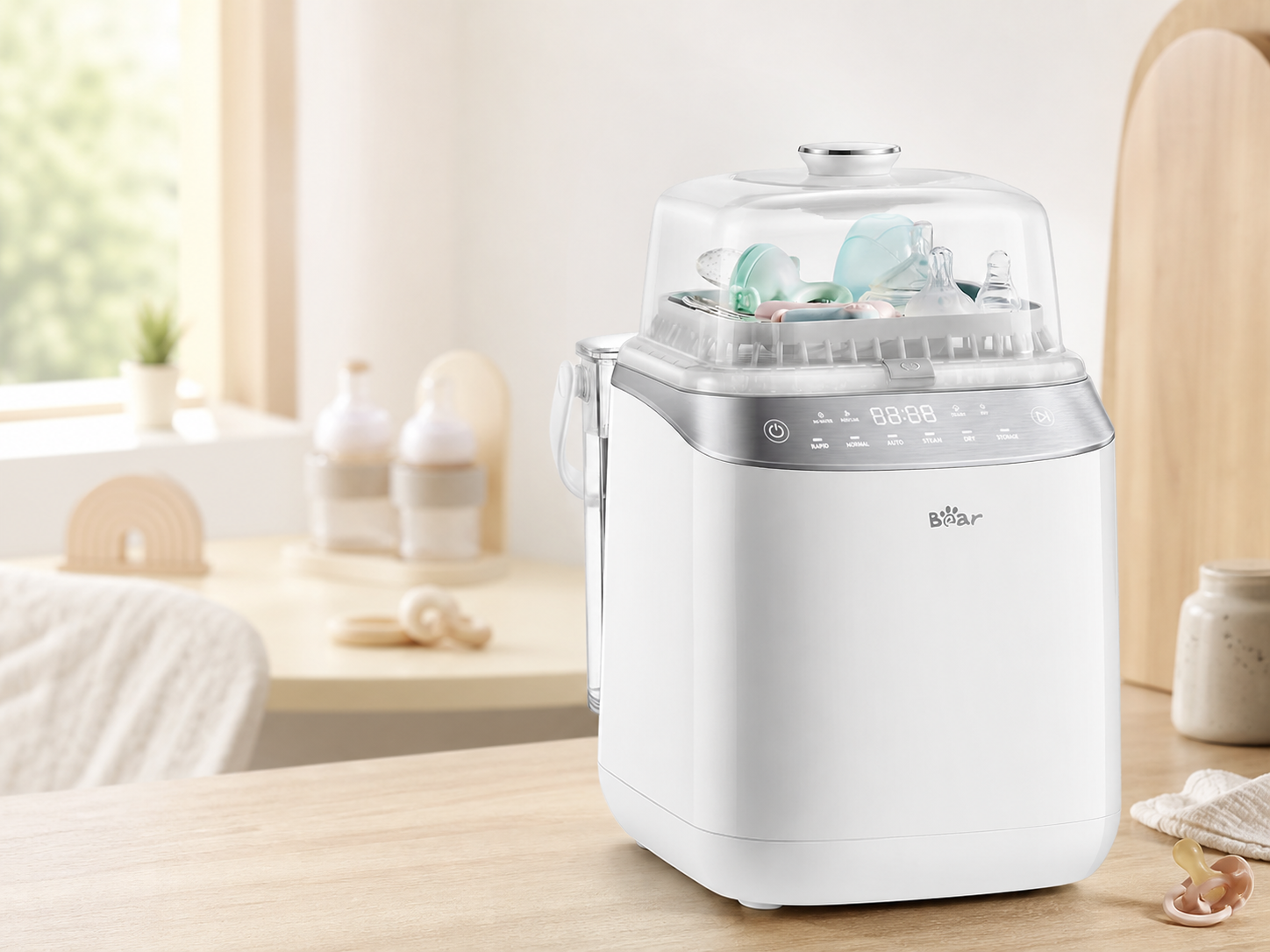 Bearforbaby Bear Bottle Washer Pro with baby bottles and feeding accessories in a nursery.
