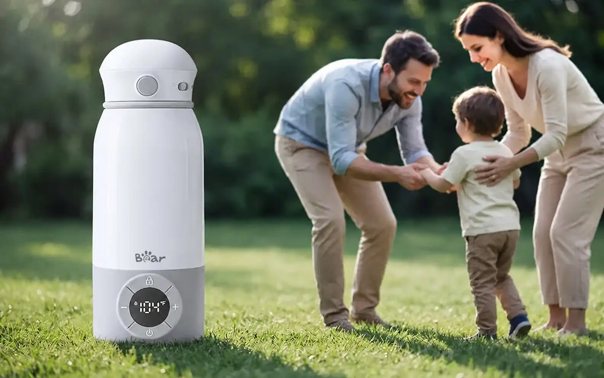 Bearforbaby Portable Bottle Warmer for Travel with a digital temperature display during an outdoor family outing.