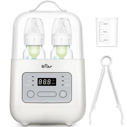 Bear Double Bottle Warmer set with accessories including a measuring cup and tongs for hygienic feeding.