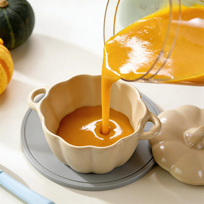 Pouring fresh pumpkin puree into a bowl prepared by the Bear NutriEase Stainless Steel Baby Food Maker.