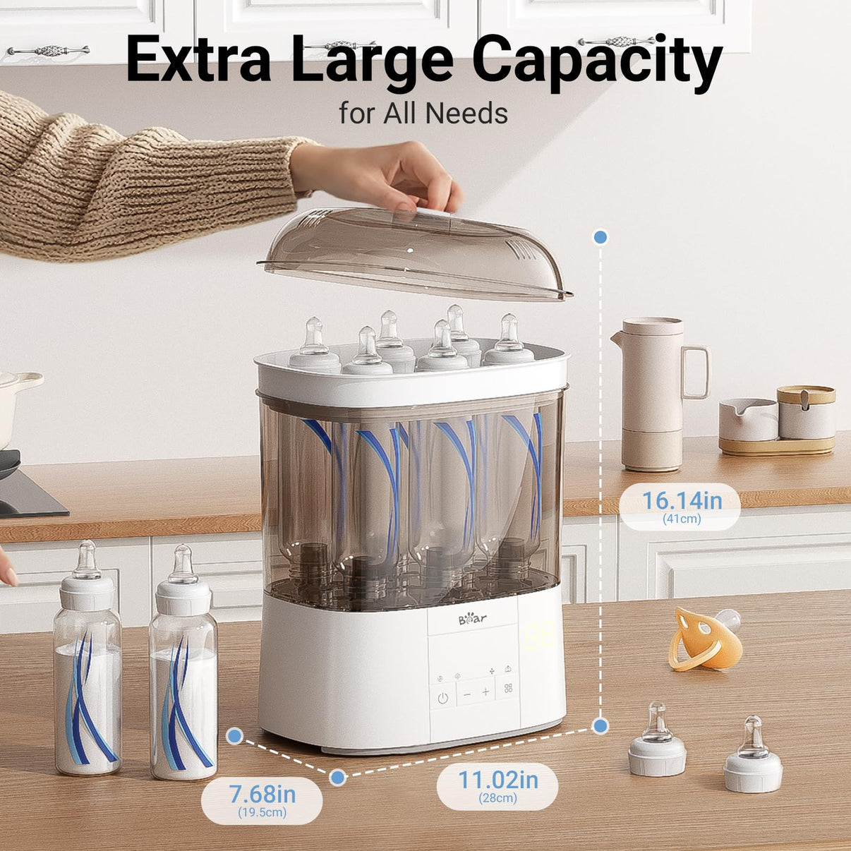 Bear 2-Tier Steam Sterilizer and Dryer showing large capacity for bottles and accessories on a kitchen counter.