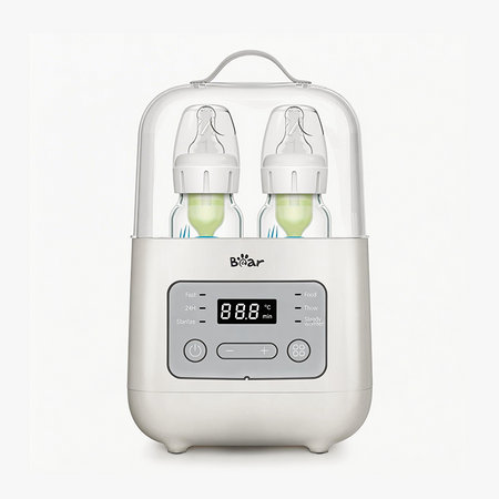 Bear Smart Double Bottle Warmer and Defroster with two baby bottles under a clear protective lid.