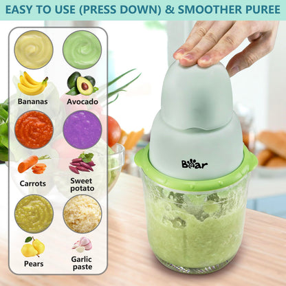 Simple press-down operation of Bear Baby Food Processor for making smooth fruit and vegetable purees.