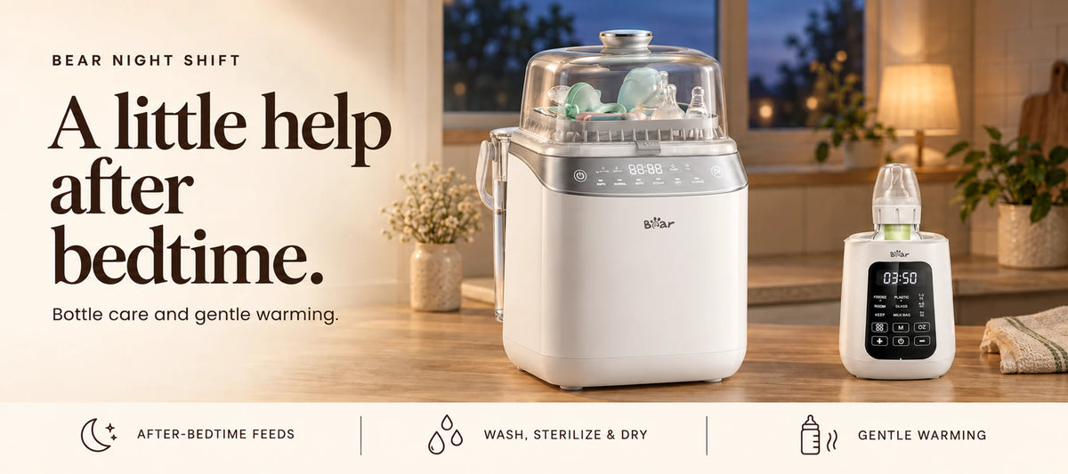 BEAR Night Shift bottle washer and bottle warmer on an oak kitchen counter with warm lighting at dusk.